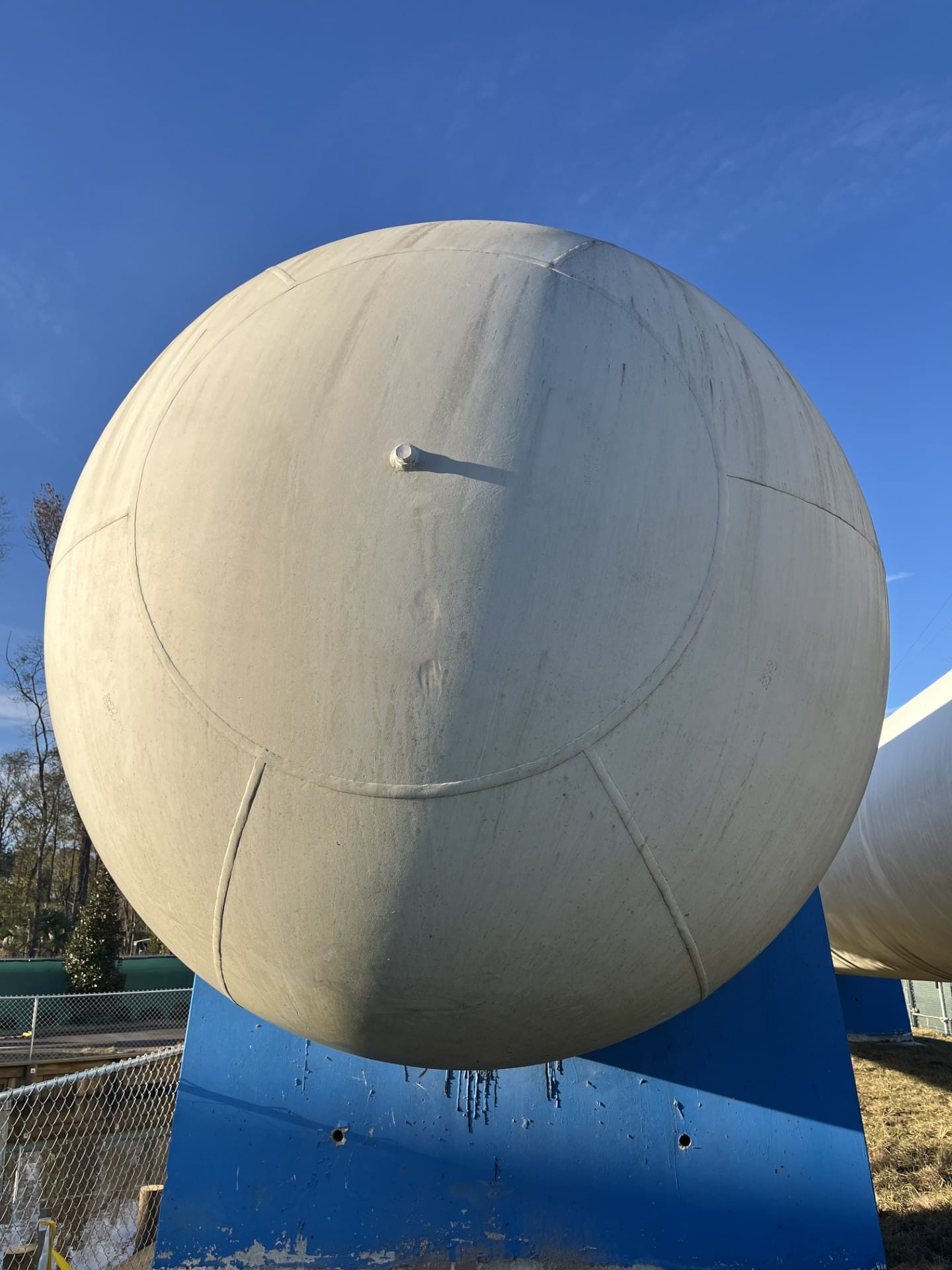 Propane tank, mid-wash — the line says it all